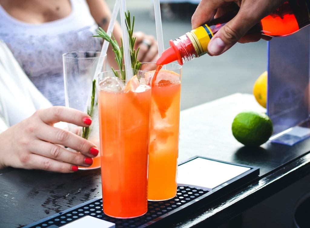 Colorful cocktails being prepared at a cruise bar
