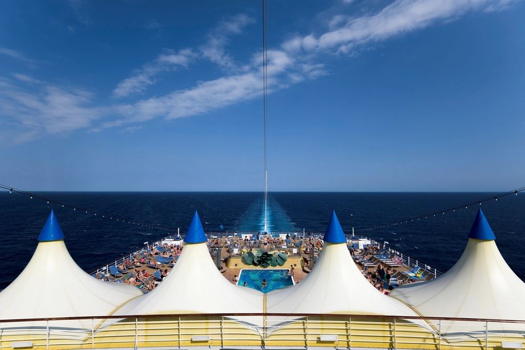 Cruise ship pool deck with loungers, the area that sits directly above many upper-deck cabins