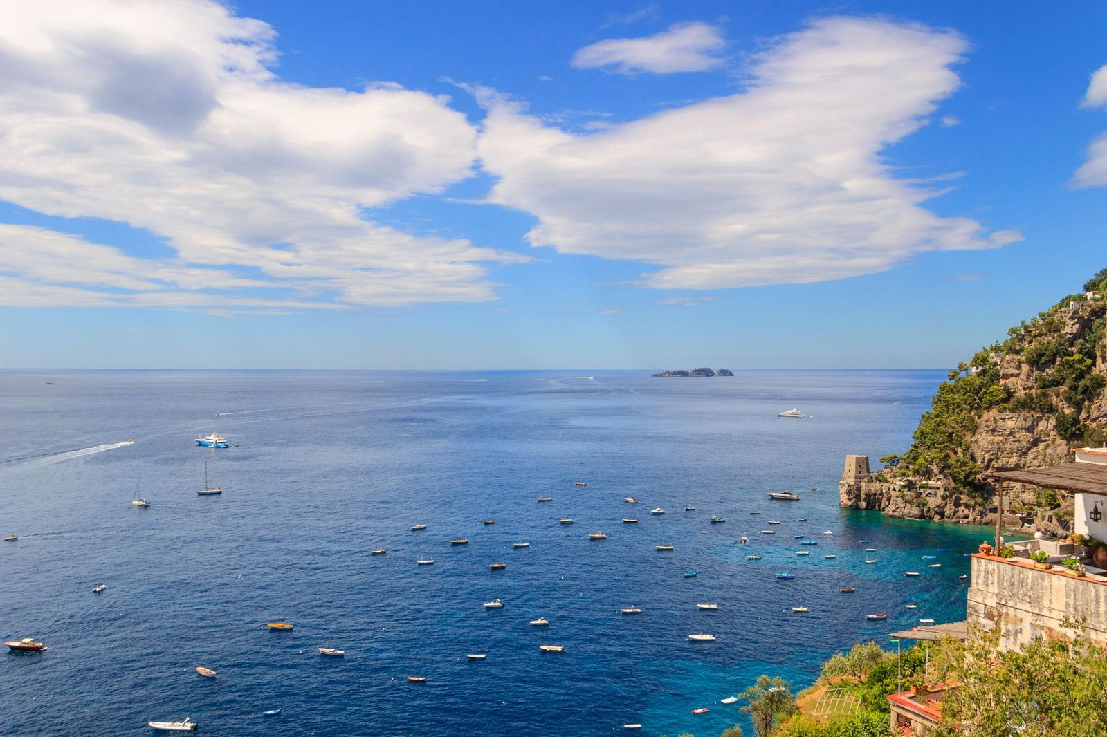 Boats on the blue sea along the Amalfi Coast in summer