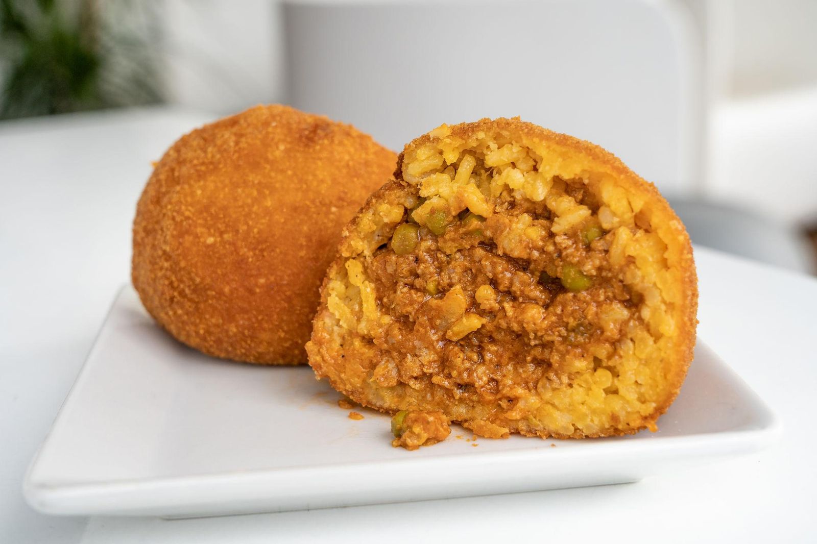 Golden fried arancini, a Sicilian street food specialty